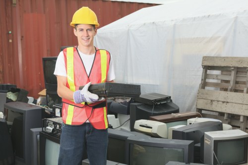 Office furniture being safely removed during clearance